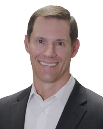 a man in a suit smiling