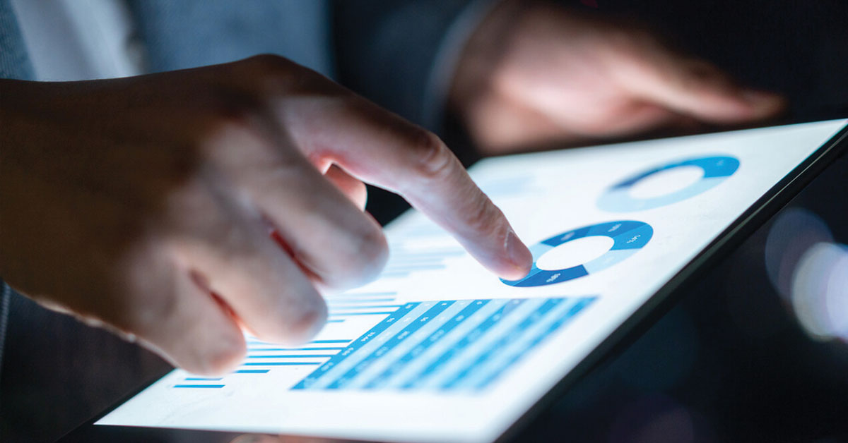 Tablet Screen with Charts a close-up of a person using a laptop
