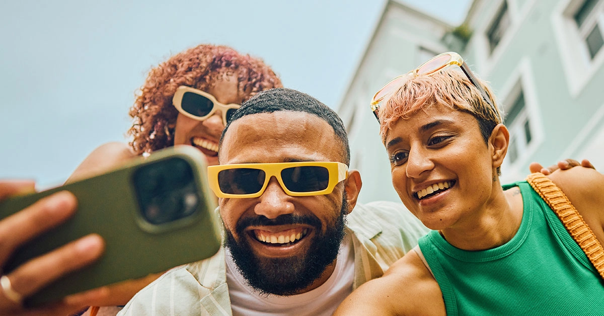 a group of people taking a selfie