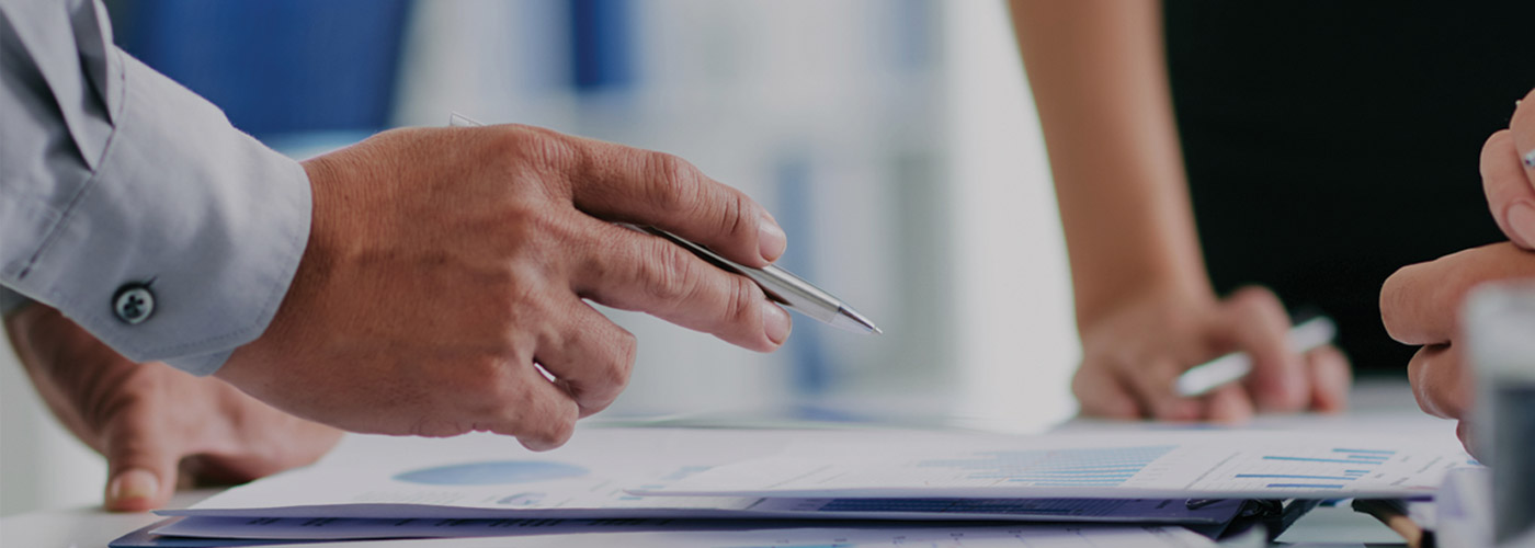 close-up of hands holding a pen