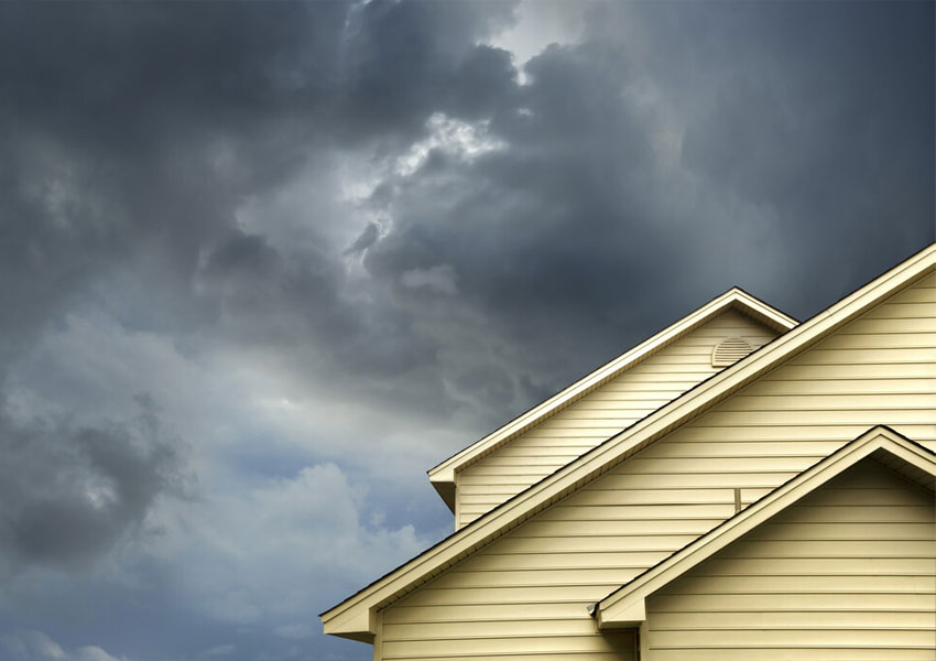 a house under a cloudy sky