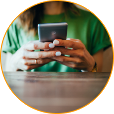 Close up of female hands holding cell phone